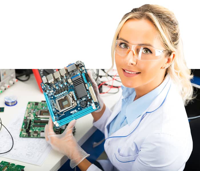 A female computer engineer works on a piece of hardware