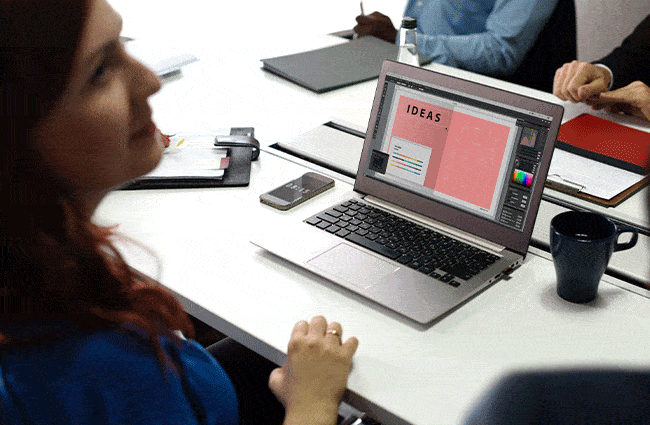 A woman works on a computer