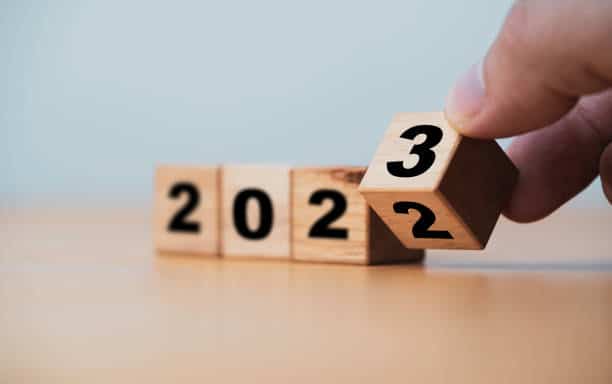 Wooden block cube flipping between 2022 to 2023